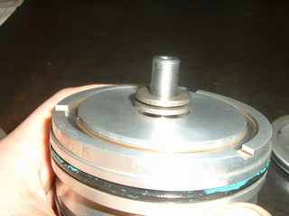 The washer should be the same diameter as the hole in the piston